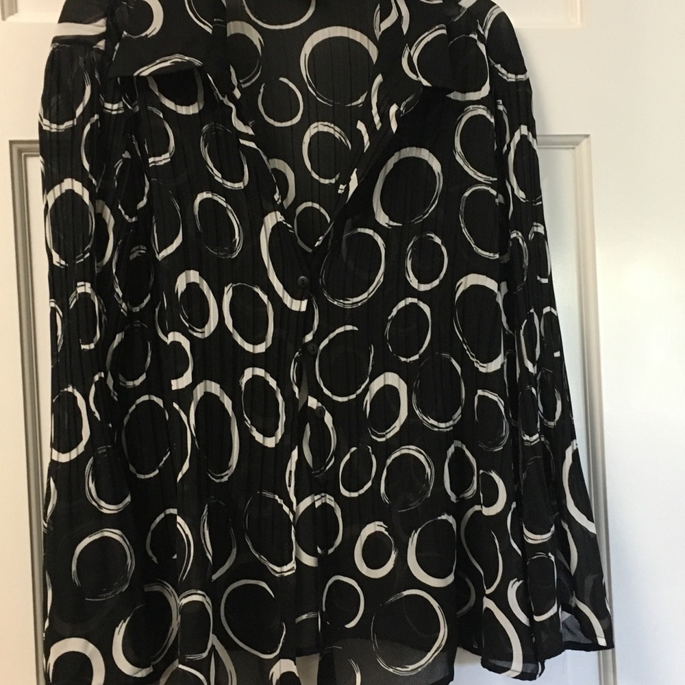 Black sheer blouse with white circles